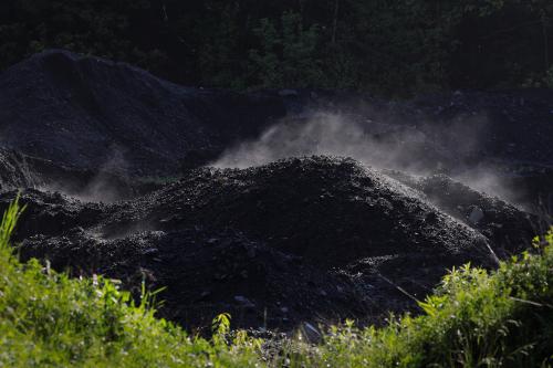 Steam rises from a pile of coal at a mine in Bishop, West Virginia, U.S., May 19, 2018.   REUTERS/Brian Snyder