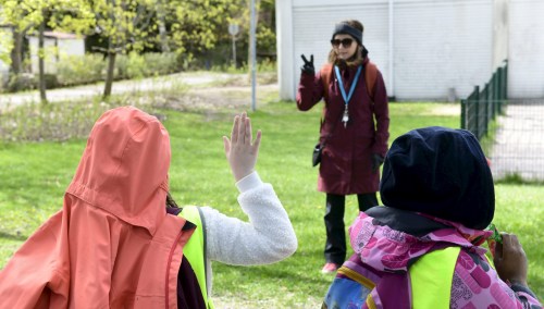 Pupils and their teacher Paivi Tihinen of the Kirsti primary school have their lessons outside in a nearby park, as schoolchildren return to classes after eight weeks of lockdown due to the coronavirus (COVID-19) spread in the country, in Espoo, Finland May 14, 2020.  Heikki Saukkomaa/Lehtikuva via REUTERS      ATTENTION EDITORS - THIS IMAGE WAS PROVIDED BY A THIRD PARTY. NO THIRD PARTY SALES. NOT FOR USE BY REUTERS THIRD PARTY DISTRIBUTORS. FINLAND OUT. NO COMMERCIAL OR EDITORIAL SALES IN FINLAND.