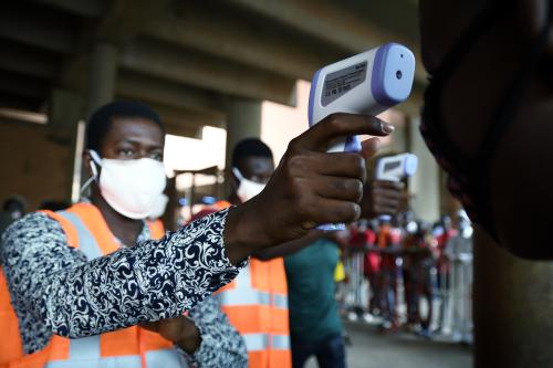 A trader’s temperature is taken at the entrance of the reopened Rood-Wooko city central market, amid the spread of the coronavirus disease (COVID-19), in Ouagadougou, Burkina Faso April 20, 2020. Picture taken April 20, 2020. REUTERS / Anne Mimault