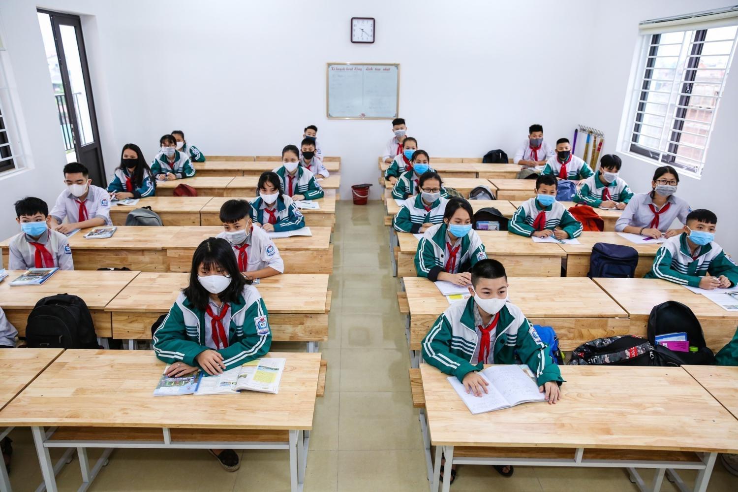 VINH, VIETNAM- Hung Binh Junior Highschool students return to class, complying with coronavirus prevention measures such as temperature control and hand washing in Vinh, Vietnam on April 27, 2020. Students from nearly 30 Vietnam's provinces and cities returned to school after a long break from early February due to COVID-19. (NO RESALE)