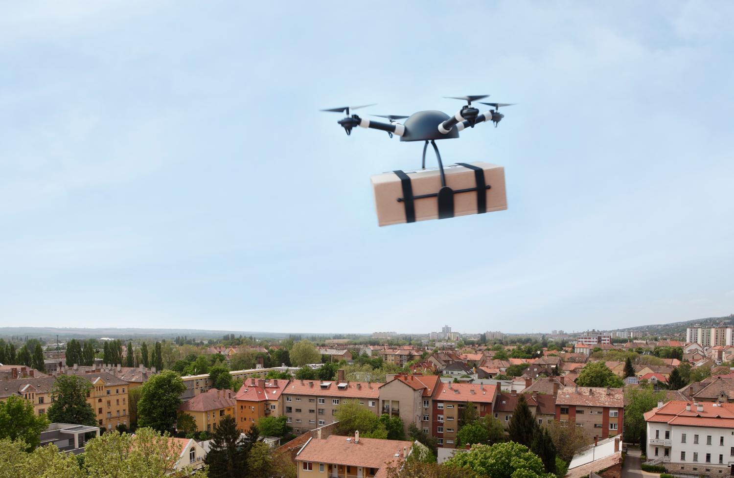 Delivery drone flying in city.IMPORTANT NOTICE:Drone made by me from households items exclusively for this image!