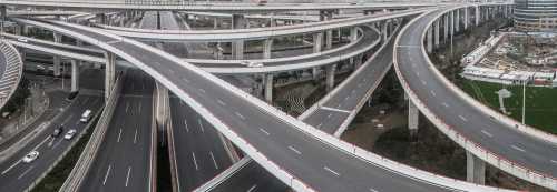 Aerial view of highway and overpass in city on a cloudy day