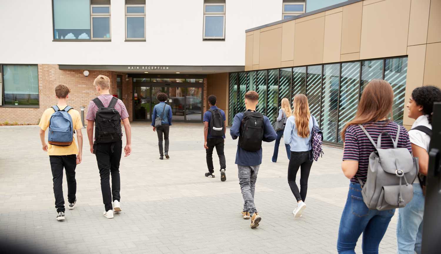 students walking into building