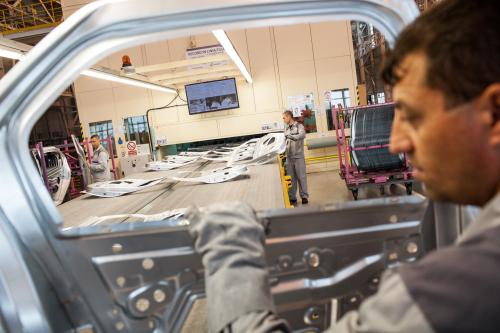 Worker on car manufacturing line