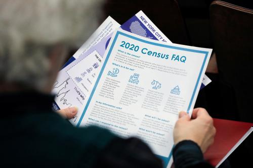 A person holds census information at an event where U.S. Rep. Alexandria Ocasio-Cortez (D-NY) spoke at a Census Town Hall at the Louis Armstrong Middle School in Queens, New York City, U.S., February 22, 2020. REUTERS/Andrew Kelly