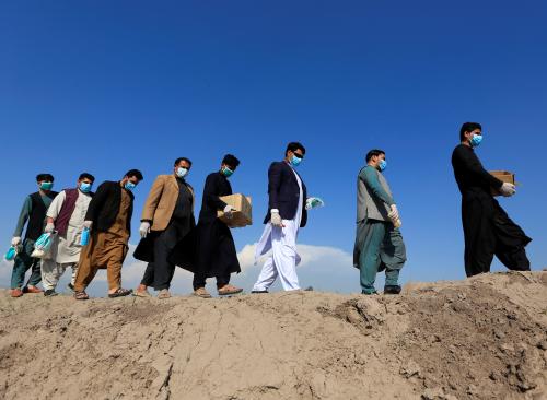 Members of civil society activists, distribute face masks to the villagers during a campaign spreading the awareness of the coronavirus disease (COVID-19), in Nangarhar province, Afghanistan March 18, 2020. REUTERS/Parwiz