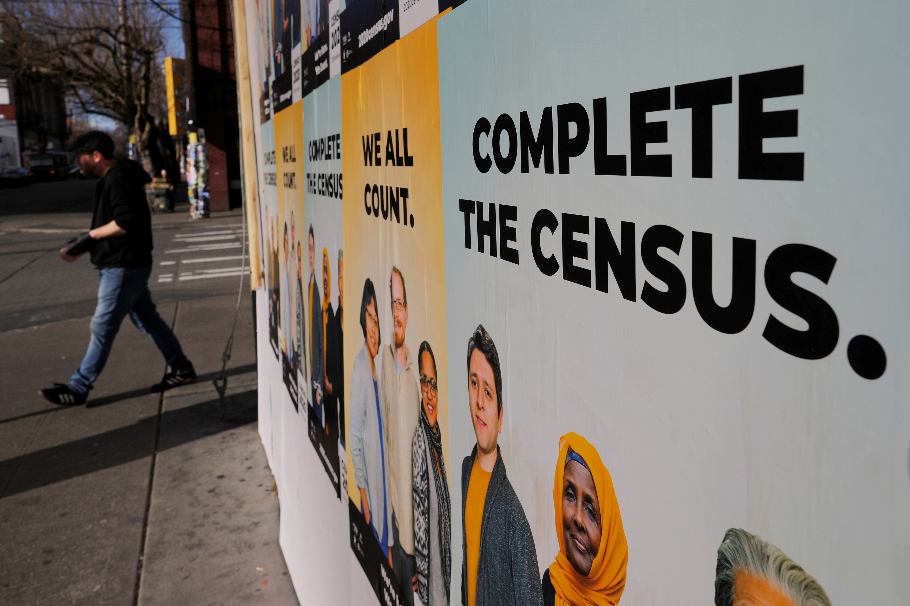 Signs advertising the 2020 U.S. Census cover a closed and boarded up business amid the coronavirus disease (COVID-19) outbreak in Seattle, Washington, U.S., March 23, 2020.  REUTERS/Brian Snyder