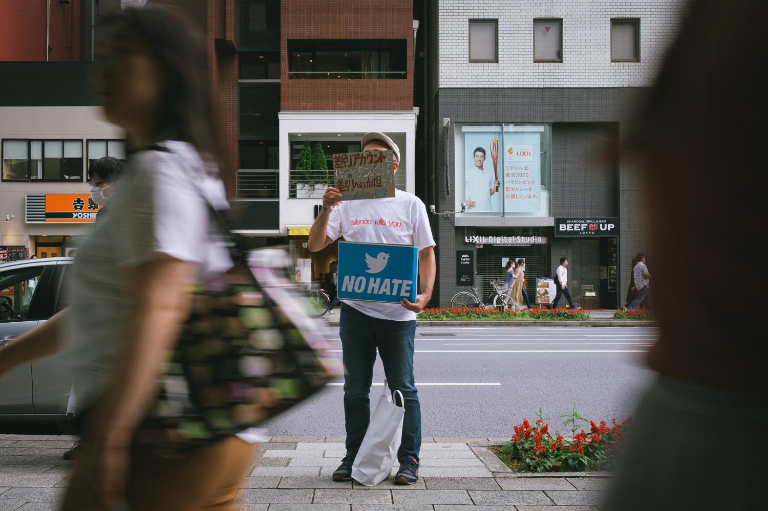 People gather in front of Twitter Japan headquarters to pressure the company to be more active against hate speech and discrimination on the platform on June 6, 2020 in Tokyo, Japan.