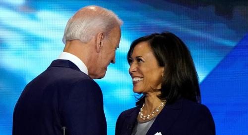 FILE PHOTO: Former Vice President Joe Biden talks with Senator Kamala Harris after the conclusion of the 2020 Democratic U.S. presidential debate in Houston, Texas, U.S., September 12, 2019. REUTERS/Mike Blake/File Photo