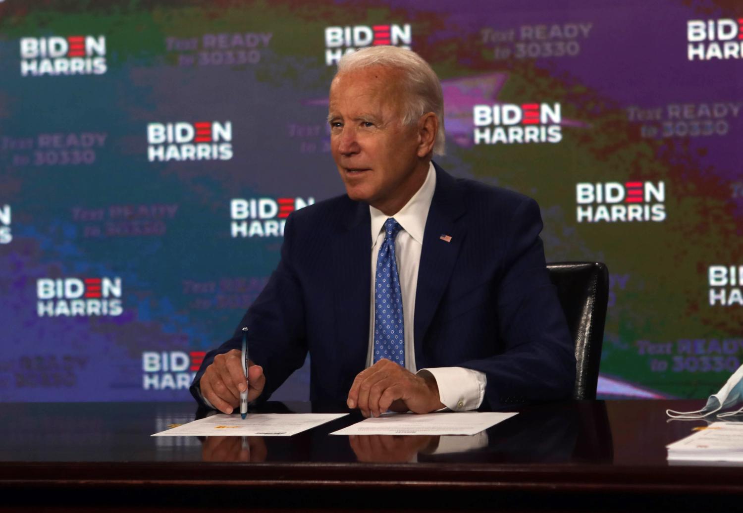 Aug 14, 2020; Presidential candidate Joe Biden signs documents for receiving the Democratic Vice Presidential nomination at the Hotel Du Pont in Wilmington, Delaware.  Mandatory Credit: Jenna Miller/Delaware News Journal via USA TODAY NETWORK