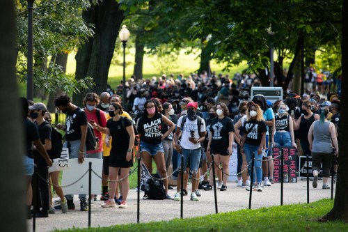 Protesters wait in line by the thousands to be let into socially distanced searing areas near the Lincoln Memorial on the National Mall before the beginning of civil rights march organized by Al Sharpton to call attention to systemic racism and police violence after the May police killing of George Floyd in Minnesota, in Washington, D.C., on August 28, 2020, amid the coronavirus pandemic. The night before The Commitment March: Get Your Knee Off Our Necks, protests consumed the blocks surrounding the White House, as President Trump gave his presidential nomination acceptance speech with sounds from noisy demonstrations in the background. (Graeme Sloan/Sipa USA)No Use UK. No Use Germany.