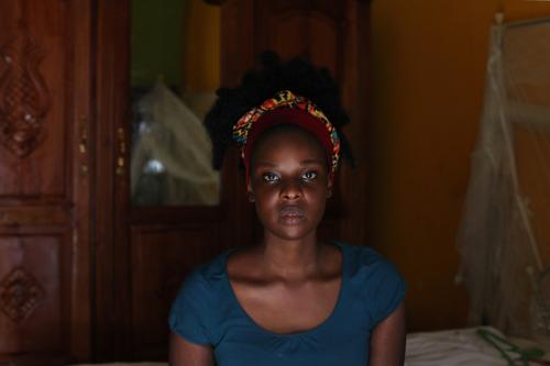 Ayak Chol Deng, 31, an epidemiologist, spoken word poet, activist, and a founding member of Ana Taban, poses for a photograph at her home in Juba, South Sudan, April 20, 2017. Deng was born in a refugee camp in Gambela, briefly lived in Cuba as a child, and then studied and lived in Kharoum, Sudan and Nairobi, Kenya. She is divorced and a mother of three. "I hope for better serviced institutions, better opportunities for youth, a country where I don't need to be from a specific tribe," said Deng. In one of her poems, she writes: "Heal this spirit that's broken, piece together pieces of me, my affiliation, or tongue, colour, politics, restore what’s human in me, peace, come find me, enrich this fist choking, un-taint my disputes, resonating, unhinge my words, elevating, unleash a conciliation, everlasting, peace, come find me." REUTERS/Andreea Campeanu  SEARCH "CAMPEANU ANA TABAN" FOR THIS STORY. SEARCH "WIDER IMAGE" FOR ALL STORIES.