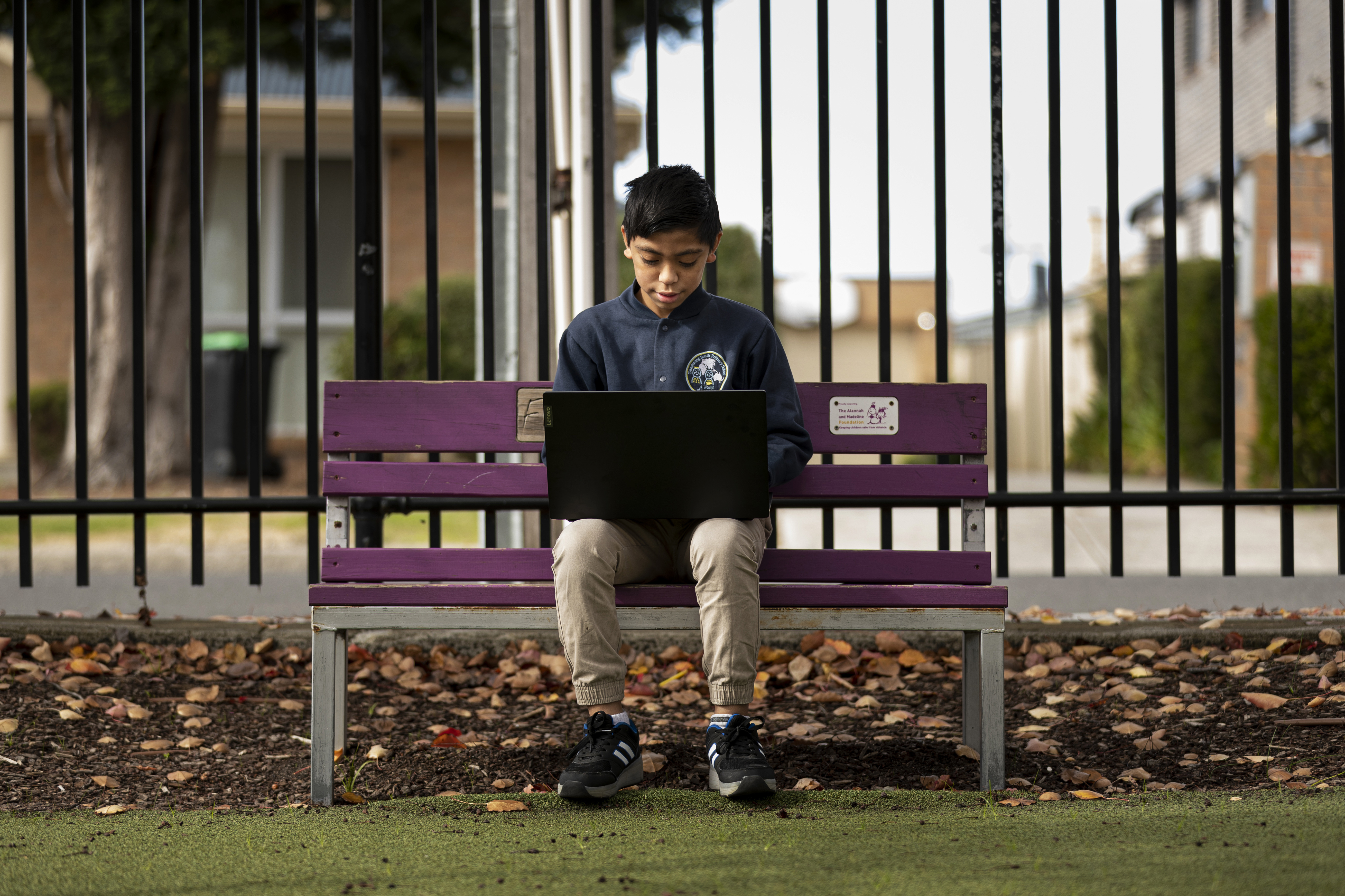 Lee Ausage tests out laptop he received from State Schools' Relief, at Dandenong South Primary School in Melbourne, Thursday, May 14, 2020. (AAP Image/Daniel Pockett) NO ARCHIVINGNo Use Australia. No Use New Zealand.