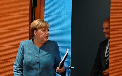 German Chancellor Angela Merkel and Finance Minister and Vice-Chancellor Olaf Scholz arrive for the weekly cabinet meeting in Berlin, Germany August 12, 2020. Tobias Schwarz/Pool via REUTERS