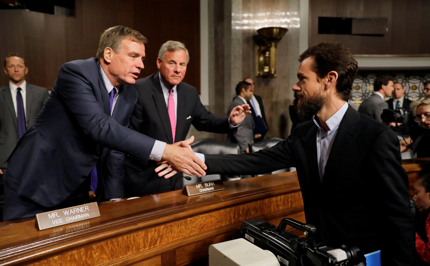 Senate Intelligence Committee Vice Chairman Senator Mark Warner and Chairman Senator Richard Burr thank Twitter CEO Jack Dorsey for his testimony at the conclusion of a hearing on foreign influence operations on social media platforms on Capitol Hill in Washington, U.S., September 5, 2018. REUTERS/Jim Bourg