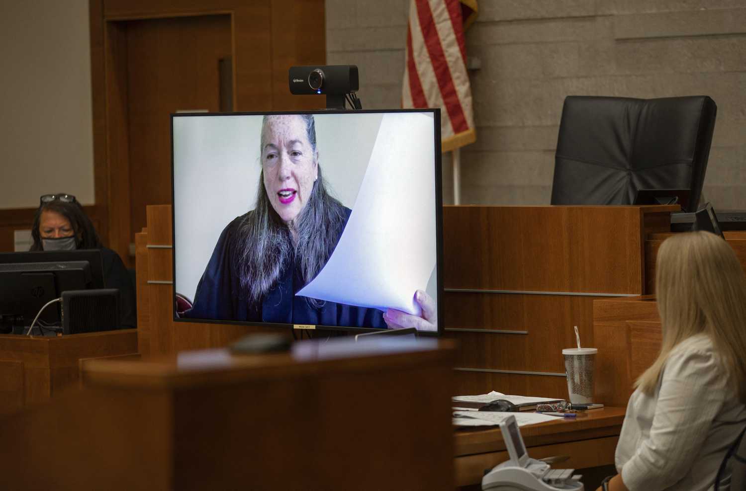 Due to the coronavirus pandemic, Franklin County Common Pleas Judge Julie M. Lynch presides over courtroom 7E from a remote location via a large video monitor with video conferencing capabilities at the downtown Columbus, Ohio, courthouse on July 1, 2020. (Adam Cairns/Columbus Dispatch/TNS/ABACAPRESS.COM - NO FILM, NO VIDEO, NO TV, NO DOCUMENTARY)