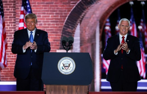 U.S. Vice President Mike Pence is joined onstage by U.S. President Donald Trump after delivering his acceptance speech as the 2020 Republican vice presidential nominee during an event of the 2020 Republican National Convention held at Fort McHenry in Baltimore, Maryland, U.S, August 26, 2020. REUTERS/Jonathan Ernst     TPX IMAGES OF THE DAY