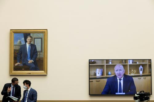 Congressional staffers confer as Amazon CEO Jeff Bezos testifies via video conference during a hearing of the House Judiciary Subcommittee on Antitrust, Commercial and Administrative Law on "Online Platforms and Market Power", in the Rayburn House office Building on Capitol Hill, in Washington, U.S., July 29, 2020. Graeme Jennings/Pool via REUTERS