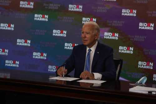 Presidential candidate Joe Biden signs documents for receiving the Democratic nomination at the Hotel Du Pont in Wilmington on Friday, Aug. 14.Biden Harris Sign Running Paperwork 8 14 2