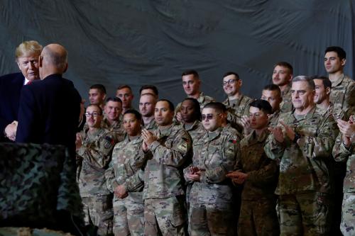 U.S. Military Joint Chief of Staff Mark Miley looks on as U.S. President Donald Trump shakes hands with Afghanistan President Ashraf Ghani during a surprise visit at Bagram Air Base in Afghanistan, November 28, 2019. REUTERS/Tom Brenner