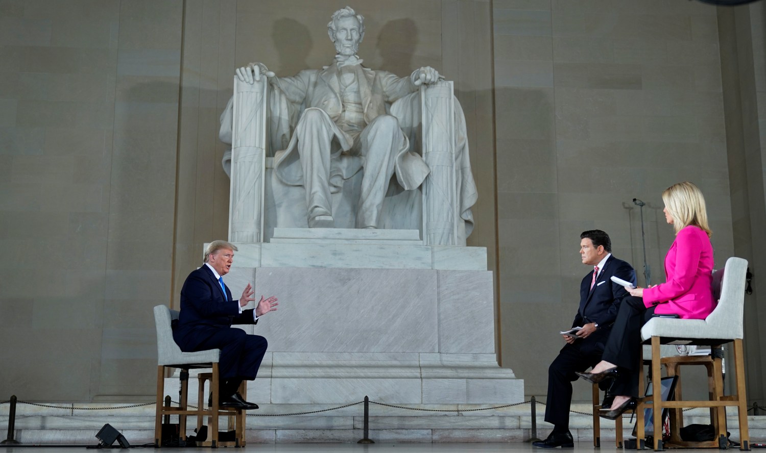 U.S. President Donald Trump is interviewed by hosts hosts Bret Baier and Martha MacCallum during a Fox News Channel virtual town hall called "America Together: Returning to Work" about the response to the coronavirus disease (COVID-19) pandemic while sitting in front of the statue of former President Abraham Lincoln inside the Lincoln Memorial in Washington, U.S. May 3, 2020.  REUTERS/Joshua Roberts