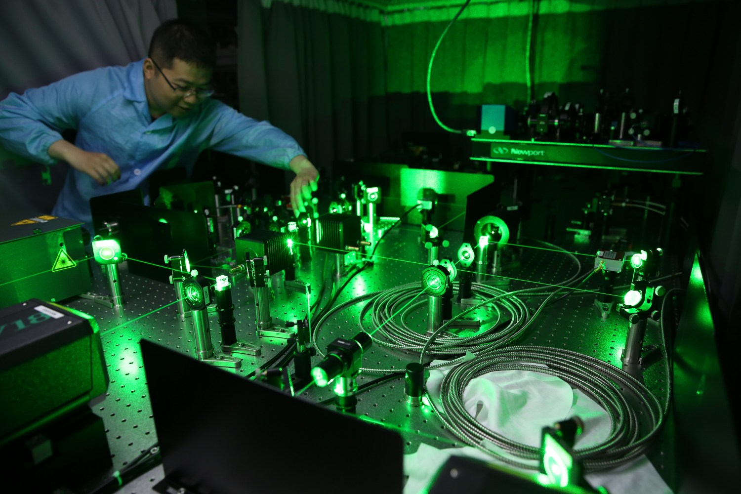 A Chinese researcher works on an ultracold atom device at the CAS-Alibaba Quantum Computing Laboratory in Shanghai, China