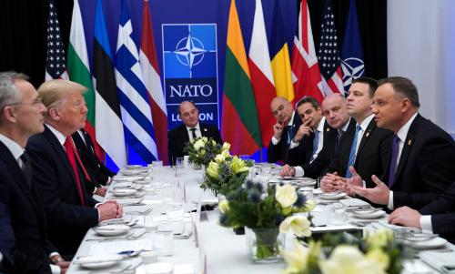 NATO Secretary General Jens Stoltenberg looks on as U.S. President Donald Trump and Poland's President Andrzej Duda talk during a working lunch during the NATO leaders summit in Watford, Britain, December 4, 2019. REUTERS/Kevin Lamarque
