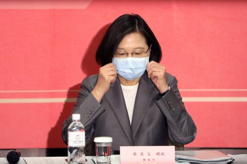 Taiwan's President Tsai Ing-wen adjusts her face mask to prevent the spread of the coronavirus disease (COVID-19) at The Third Wednesday Club, a high-profile private industry trade body in Taipei, Taiwan, August 19, 2020. REUTERS/Ann Wang