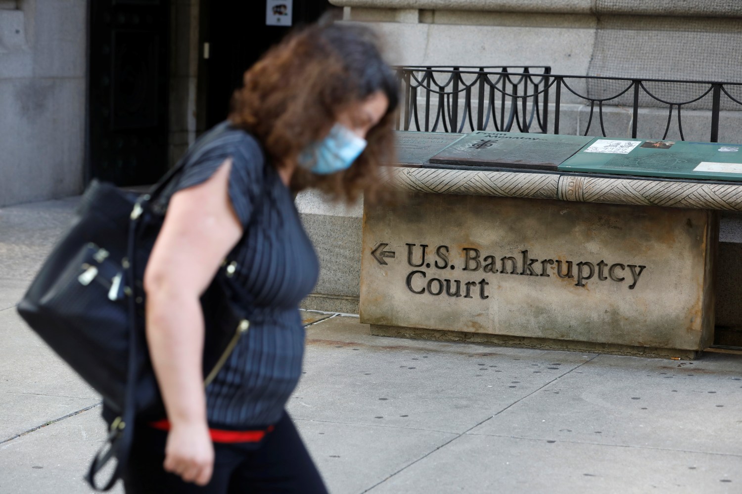 A person walks by the United States Bankruptcy Court for the Southern District of New York in Manhattan, New York City, U.S., August 24, 2020. REUTERS/Andrew Kelly