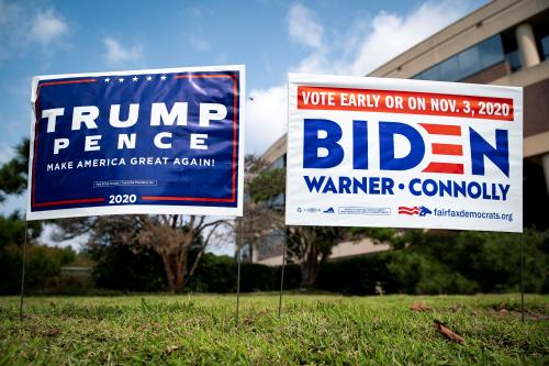 FILE PHOTO: Yard signs supporting U.S. President Donald Trump and Democratic U.S. presidential nominee and former Vice President Joe Biden are seen outside of an early voting site at the Fairfax County Government Center in Fairfax, Virginia, U.S., September 18, 2020. REUTERS/Al Drago/File Photo