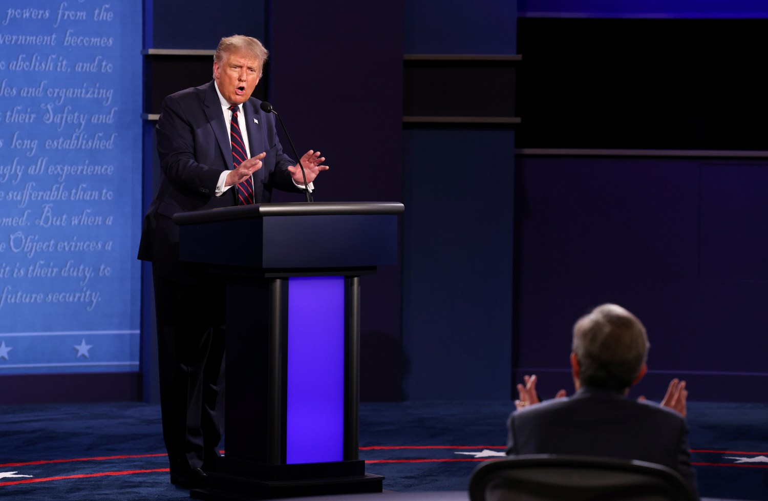President Donald Trump argues with debate moderator Chris Wallace of Fox News Channel during the first 2020 presidential campaign debate with Democratic presidential nominee Joe Biden held on the campus of the Cleveland Clinic at Case Western Reserve University in Cleveland, Ohio, U.S., September 29, 2020. REUTERS/Jonathan Ernst