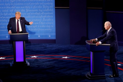 FILE PHOTO: U.S. President Donald Trump and Democratic presidential nominee Joe Biden participate in their first 2020 presidential campaign debate held on the campus of the Cleveland Clinic at Case Western Reserve University in Cleveland, Ohio, U.S., September 29, 2020. REUTERS/Brian Snyder/File Photo