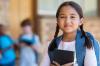 smiling girl getting ready for school