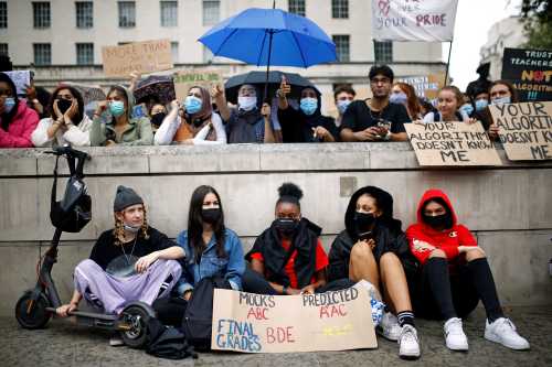 A group of British students protest the use of algorithms to predict their grades on standardized exams.