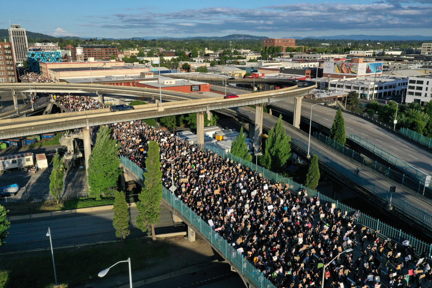 Protesters walk onto Morrison Bridge while rallying against the death in Minneapolis police custody of George Floyd, in Portland, Oregon, U.S. June 3, 2020. Picture taken with a drone. REUTERS/Terray Sylvester