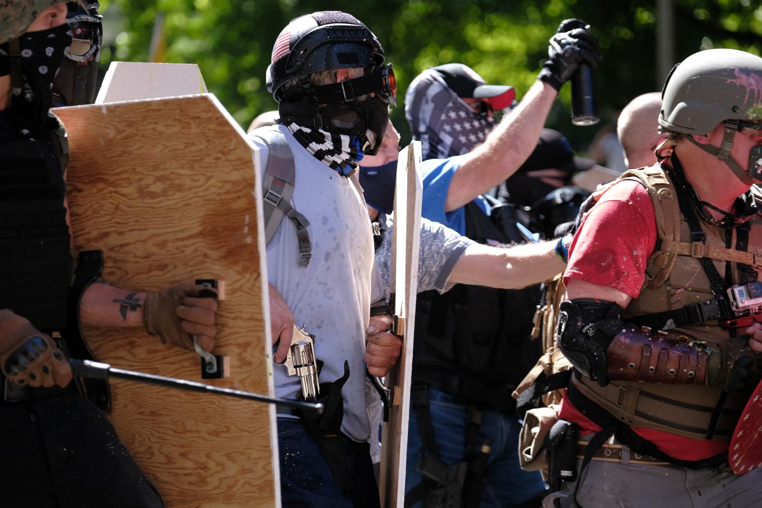 A Trump supporter reaches for his revolver as Black Lives Matter protesters advance to push the group away from the Justice Center in Portland, Ore., on August 22, 2020. (Photo by Alex Milan Tracy/Sipa USA)No Use UK. No Use Germany.