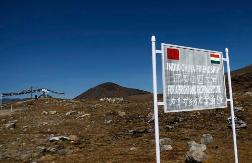 A signboard is seen from the Indian side of the Indo-China border at Bumla, in the northeastern Indian state of Arunachal Pradesh, November 11, 2009. With ties between the two Asian giants strained by a flare-up over their disputed boundary, India is fortifying parts of its northeast, building new roads and bridges, deploying tens of thousands more soldiers and boosting air defences. Picture taken November 11, 2009.   REUTERS/Adnan Abidi (INDIA POLITICS MILITARY) - GM1E5BD1BOA01