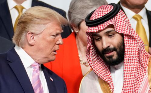 U.S. President Donald Trump speaks with Saudi Arabia's Crown Prince Mohammed bin Salman during family photo session with other leaders and attendees at the G20 leaders summit in Osaka, Japan, June 28, 2019.  REUTERS/Kevin Lamarque     TPX IMAGES OF THE DAY