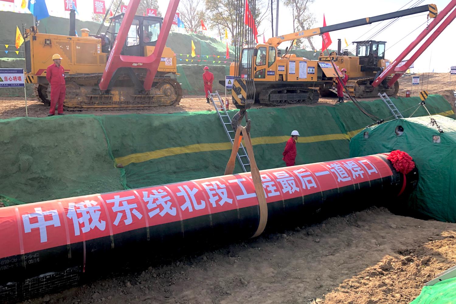 Workers are seen working at the construction site of a natural gas pipeline as part of China-Russia gas pipeline project in Heihe city, north-east China's Heilongjiang province, 16 October 2019.Natural gas will start flowing through the China-Russia east route natural gas pipeline from December, and will help meet clean energy demand in several places across Northeast China, the Beijing-Tianjin-Hebei region, and the Yangtze River Delta area, China National Petroleum Corp said on Thursday, 28 November 2019.No Use China. No Use France.