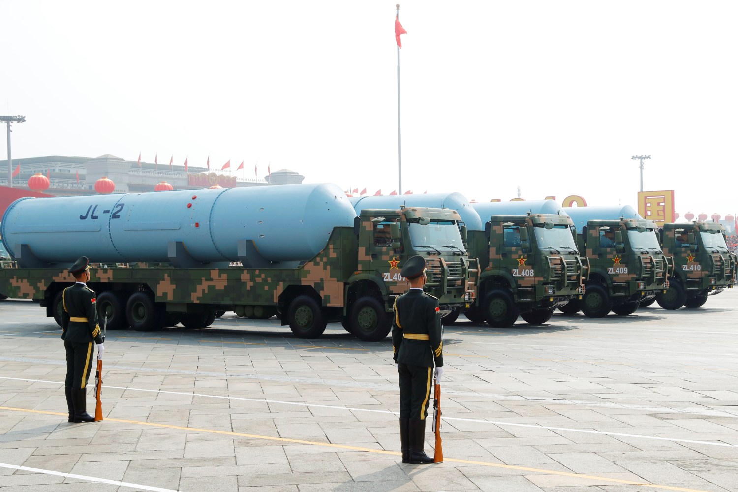 Military vehicles carrying JL-2 submarine launched ballistic missiles drive past Tiananmen Square during the military parade marking the 70th founding anniversary of People's Republic of China, on its National Day in Beijing, China October 1, 2019.  REUTERS/Thomas Peter