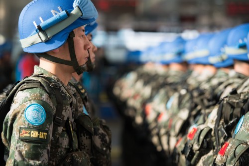 --FILE--Chinese peacekeepers line up during a departure ceremony before flying to South Sudan for UN peacekeeping missions at Jinan Yaoqiang International Airport in Jinan city, east China's Shandong province, 7 April 2015.China will contribute 8,000 troops for a United Nations peacekeeping standby force, China's President Xi Jinping told the United Nations General Assembly on Monday (28 September 2015), a move that could make it one of the largest players in U.N. peacekeeping efforts. Xi's pledge comes as China is trying to show it is a responsible international player amid concern over its growing military might and territorial disputes in the Asia-Pacific region. During a state visit to Washington on Friday, Xi agreed with U.S. President Barack Obama that both countries would increase their "robust" peacekeeping commitments. "China will join the new U.N. peacekeeping capability readiness system, and has thus decided to lead in setting up a permanent peacekeeping police squad and build a peacekeeping standby force of 8,000 troops," Xi said.No Use China. No Use France.