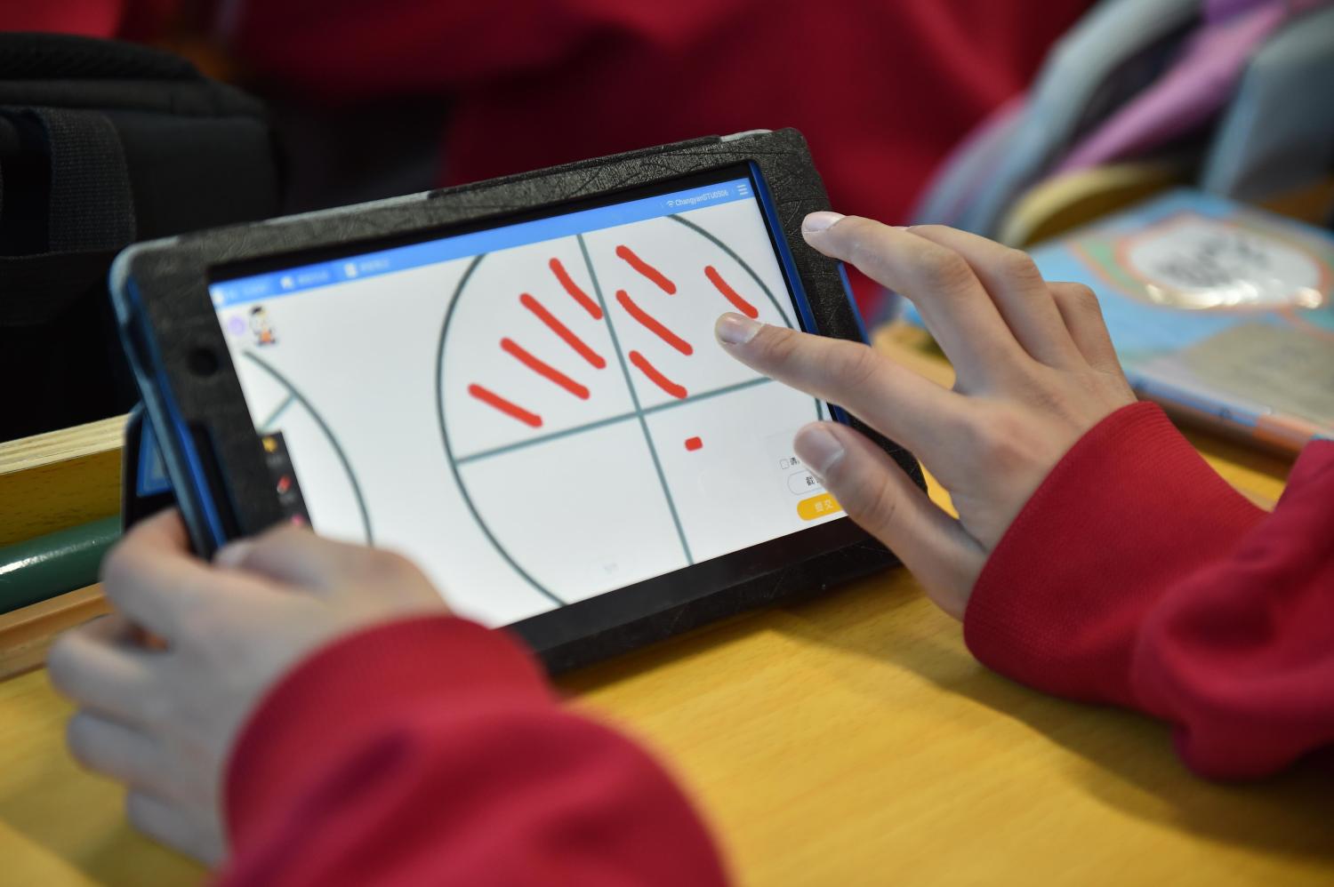 Students use tablet PCs as they have a lesson in the classroom at a primary school in Langfang city, south China's Hebei province, 24 April 2018.A primary school in Langfang city of Hebei province has introduced tablet PCs into class to facilitate the mathematics teaching. Every student is equipped with a tablet computer in class. The primary school is the first piloted school for smart class in the city. Currently, electronic devices have been applied to seven schools.No Use China. No Use France.