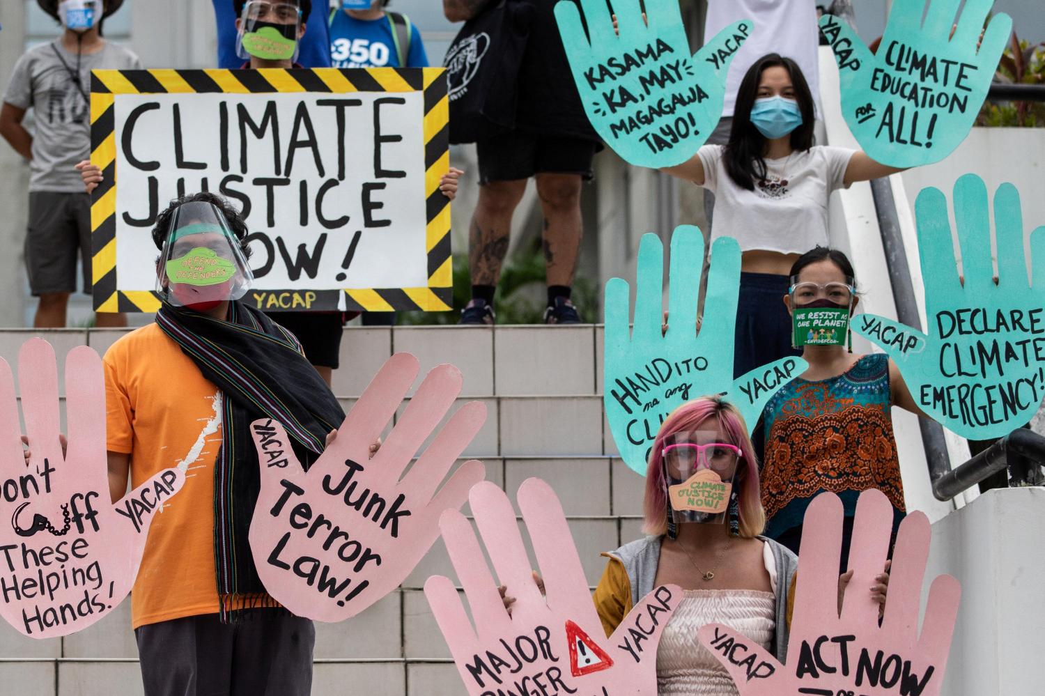 Filipino climate activists hold placards calling for climate action in participation with the global climate change protests, in Quezon City, Metro Manila, Philippines, September 25, 2020. REUTERS/Eloisa Lopez