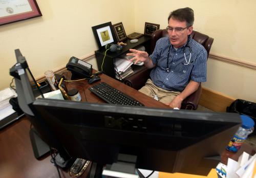Dr. Randall Reese, a pediatrician at Pensacola Pediatrics, logs on to meet with a patient during a telehealth session at his office in Gulf Breeze on Monday, May 18, 2020.Teledoc Reese