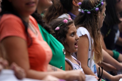 A child reacts during a demonstration in support of women and against gender violence, in Buenos Aires, Argentina March 9, 2020. REUTERS/Mariana Greif