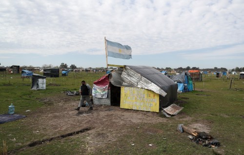 A man is seen at a patch of land he occupied, amid the spread of the coronavirus disease (COVID-19) in Guernica, on the outskirts of Buenos Aires, Argentina September 15, 2020. Picture taken September 15, 2020. REUTERS/Agustin Marcarian
