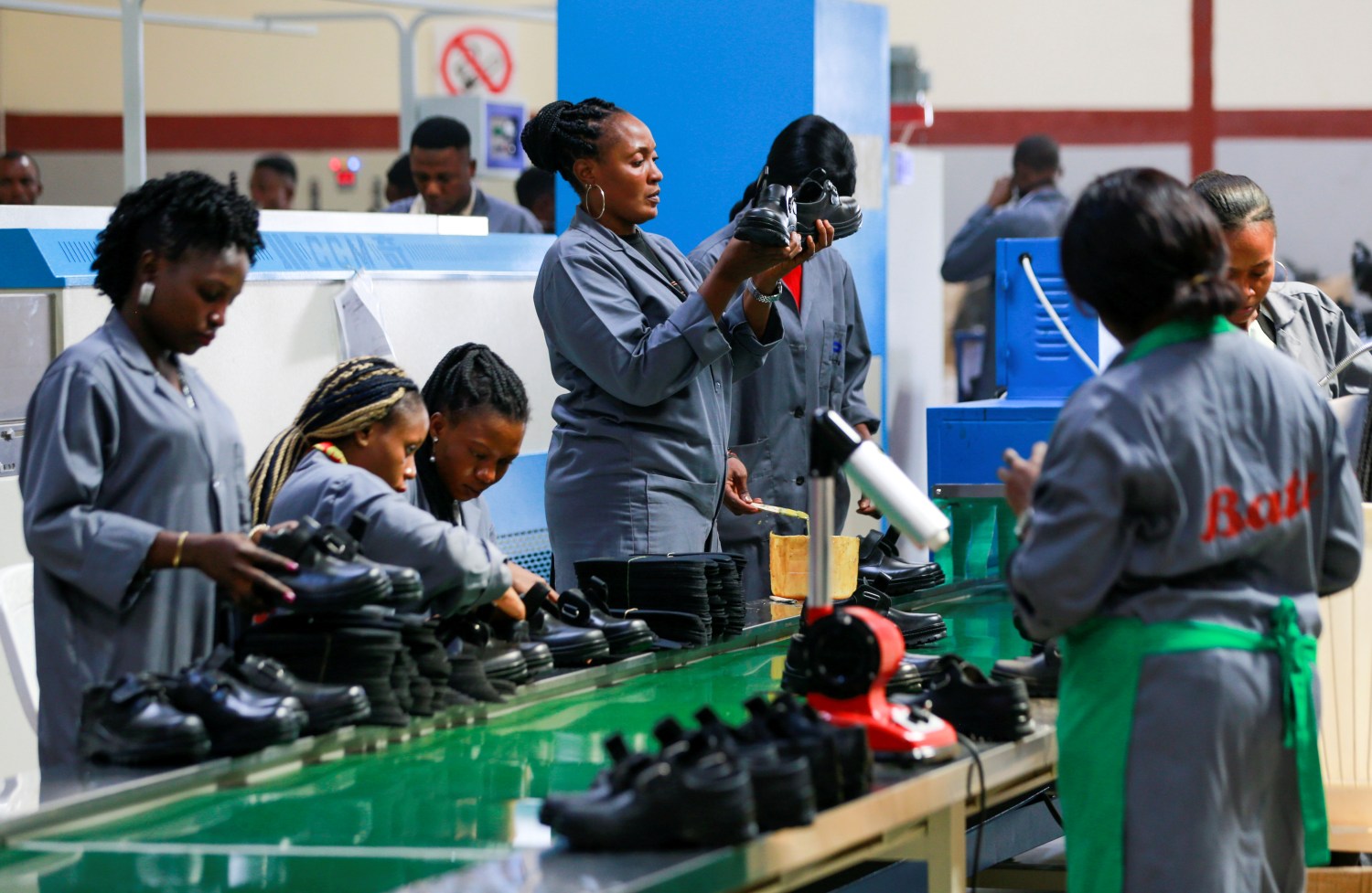 Women workers inspect shoes at a Bata shoe factory in Abuja, Nigeria January 13, 2020. Picture taken January 13, 2020. REUTERS/Afolabi Sotunde