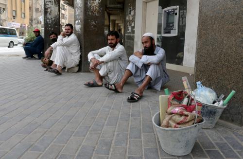 Foreign workers sit on the street after losing their jobs, following the outbreak of the coronavirus disease (COVID-19), in Riyadh, Saudi Arabia, May 7, 2020. REUTERS/Ahmed Yosri