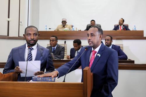 Somalia's Supreme Court Chairman Baashe Yusuf Ahmed swears in new prime minister Mohamed Hussein Roble in front of Somali parliament members in Mogadishu, Somalia September 23, 2020. REUTERS/Feisal Omar