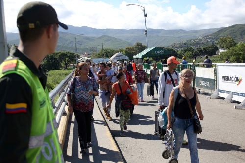 People cross the Colombian-Venezuelan border over the partially opened Simon Bolivar international bridge in San Antonio del Tachira, Venezuela June 8, 2019. REUTERS/Carlos Eduardo Ramirez